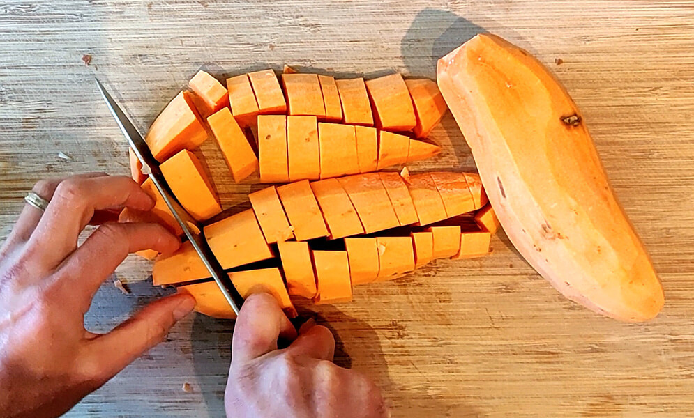 Cutting up sweet potato for the soup