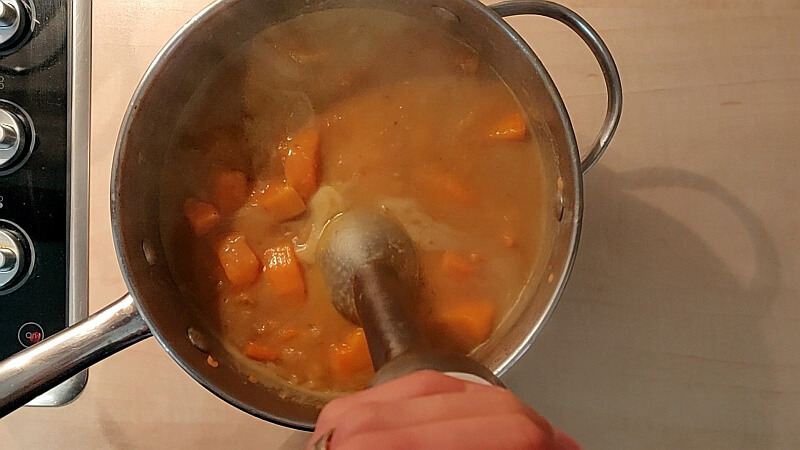 Mixing the soup and adjusting seasoning