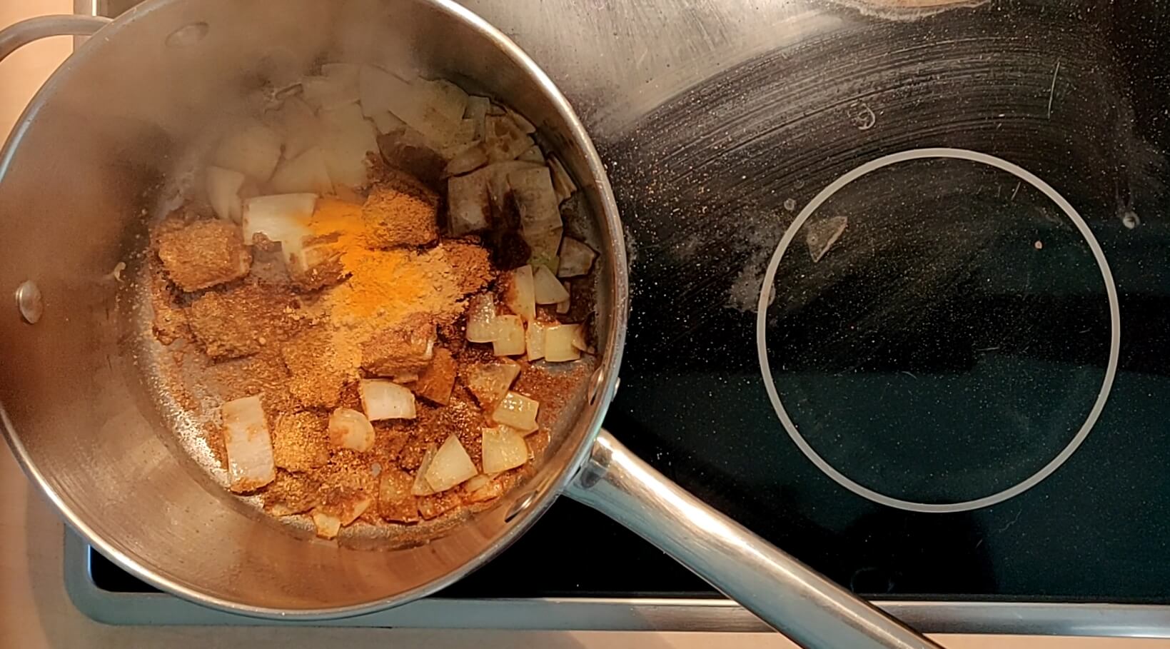 Frying off the spices for the tofu vegetable curry