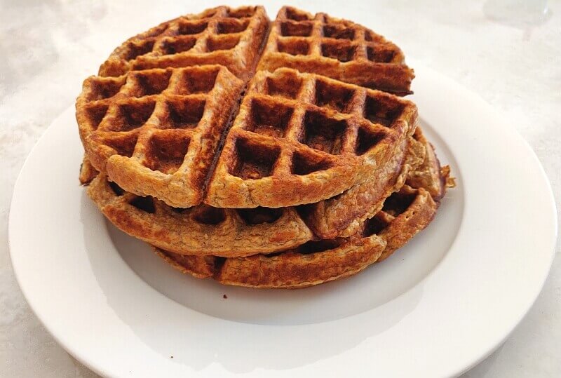 Stack of banana oat waffles on a plate